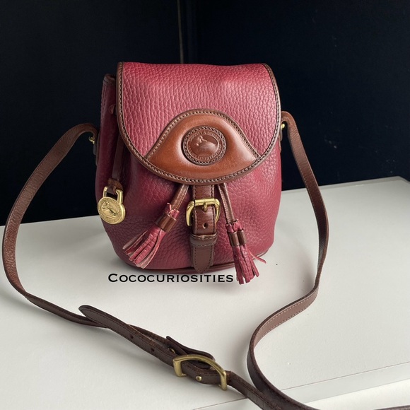 Dooney & Bourke Handbags - Dooney and Bourke awl leather Rouge Chocolate Raspberry Vintage Pouch Crossbody